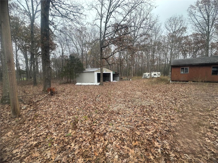 View of yard featuring an outdoor structure