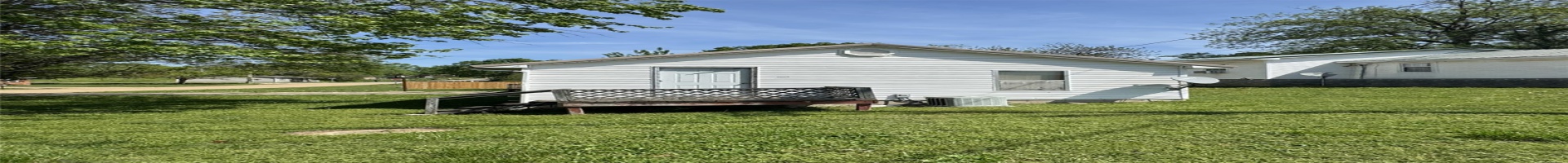 Residential For Sale Back of house with cooling unit and a lawn