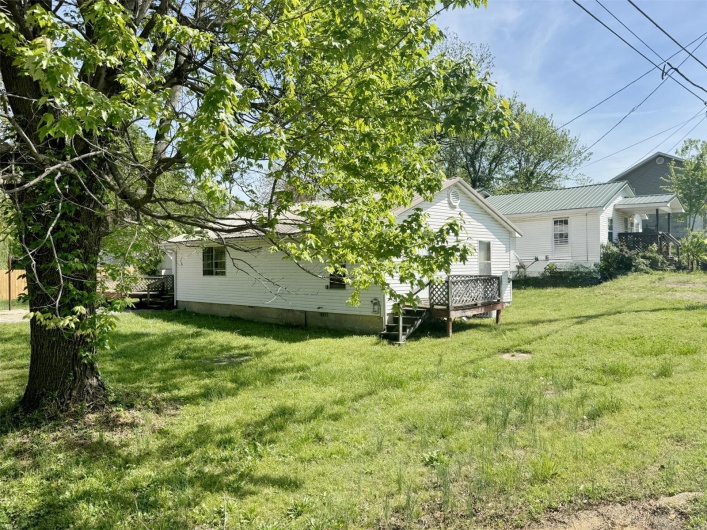 View of yard featuring a wooden deck