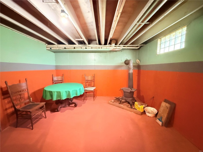 Basement featuring a wood stove