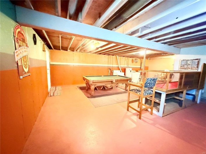 Game room featuring concrete flooring and billiards