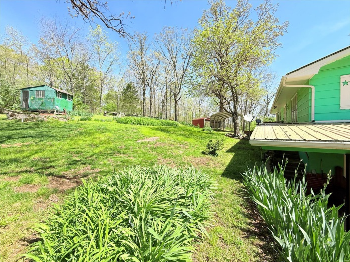 View of yard with a detached carport