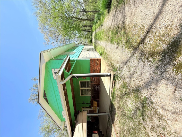 View of home's exterior featuring driveway