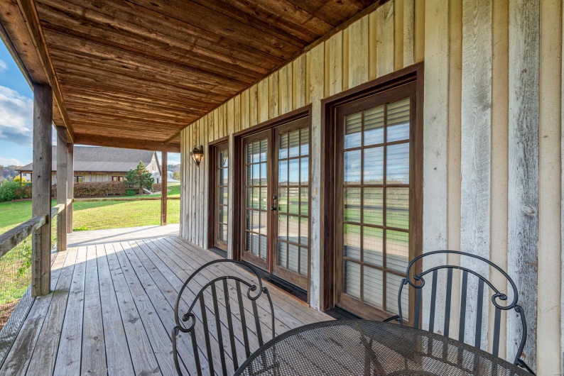 Wooden terrace with french doors and a porch