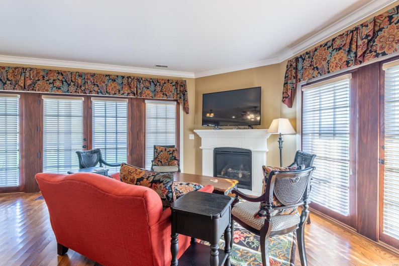 Living room featuring crown molding and wood-type flooring