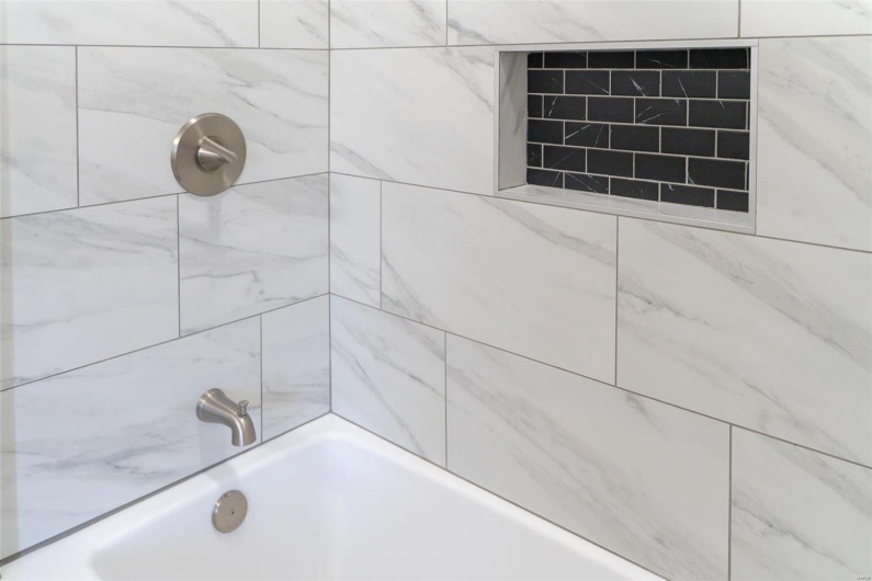 Bathroom featuring tiled shower / bath