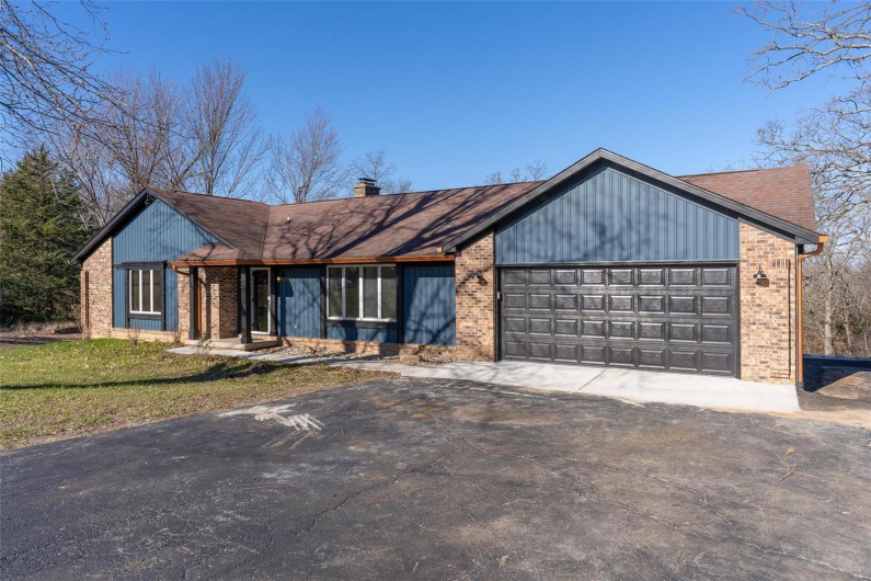 View of front of property featuring a garage