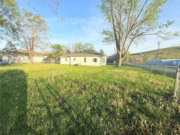 View of yard featuring fence
