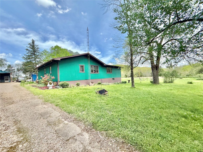 View of home's exterior with a yard