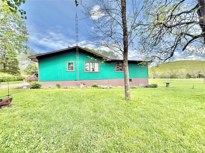View of home's exterior with a yard