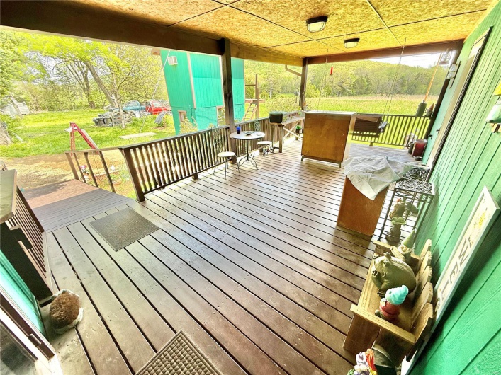 Wooden deck featuring a yard