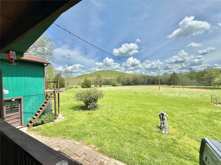 View of yard featuring stairway