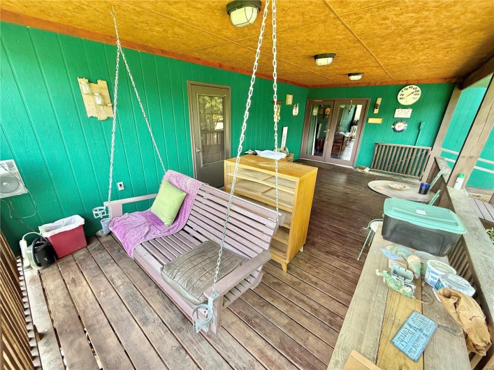 Wooden deck featuring french doors