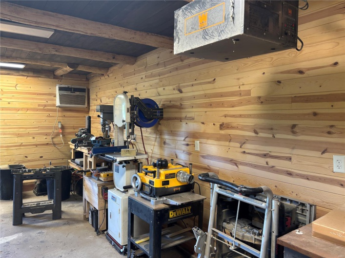 Storage area featuring a wall mounted AC
