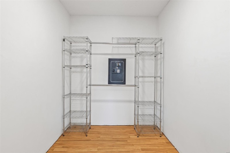 Walk in closet featuring wood finished floors