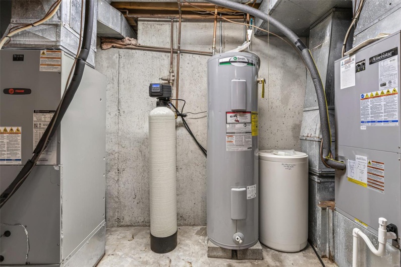 Utility room featuring heating unit