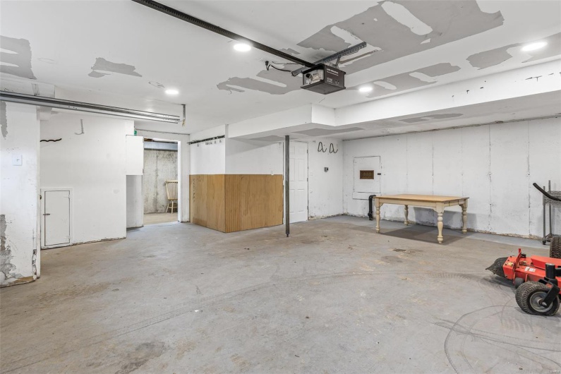 Garage featuring a garage door opener