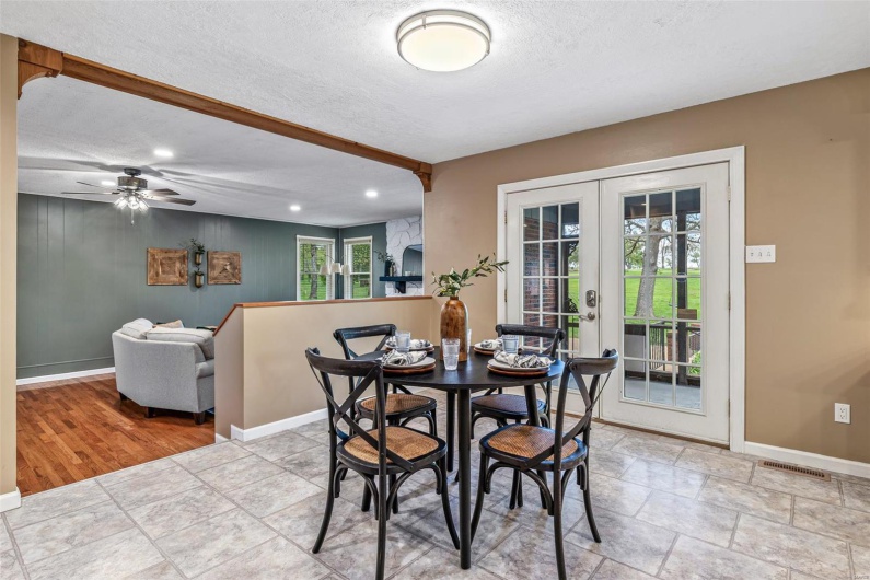 Dining space featuring french doors, a textured ceiling, baseboards, visible vents, and recessed lighting
