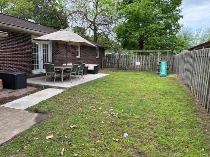 View of yard with a patio area and a fenced backyard