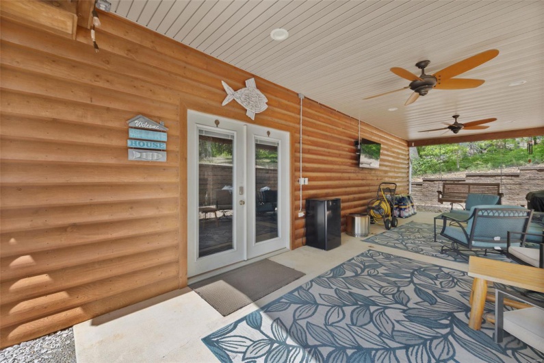 View of patio with french doors, an outdoor living space, and ceiling fan