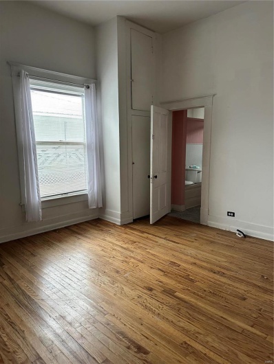Unfurnished bedroom with light hardwood / wood-style flooring