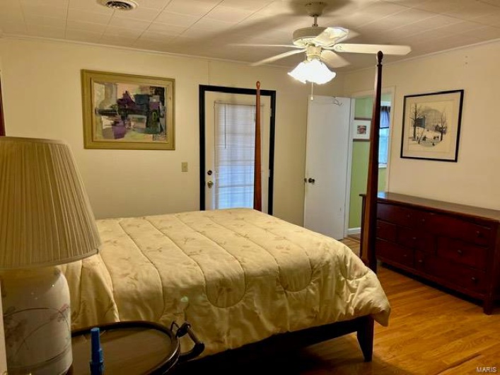 Main bedroom with screened porch off of bedroom