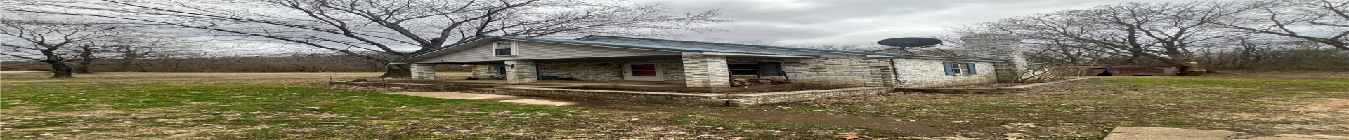 Residential For Sale View of property exterior featuring a yard and covered porch