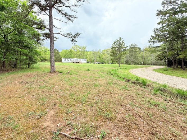 View of yard with a forest view