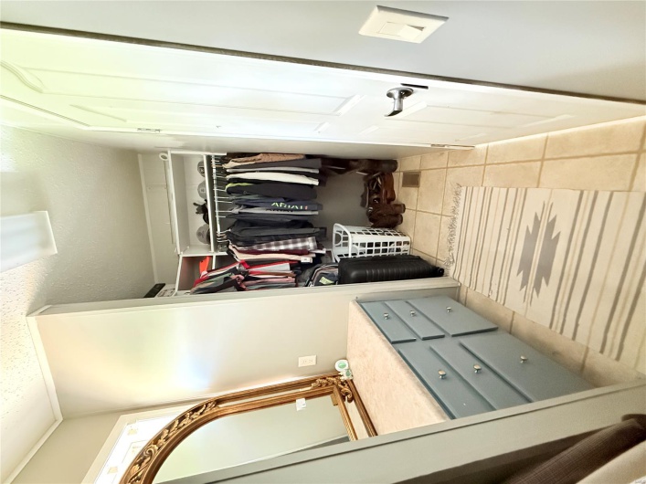 Spacious closet featuring light tile patterned flooring