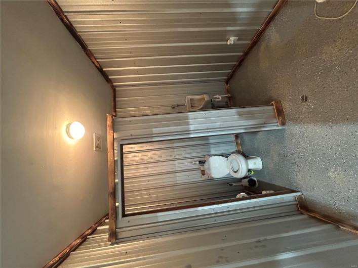 Bathroom featuring visible vents and toilet