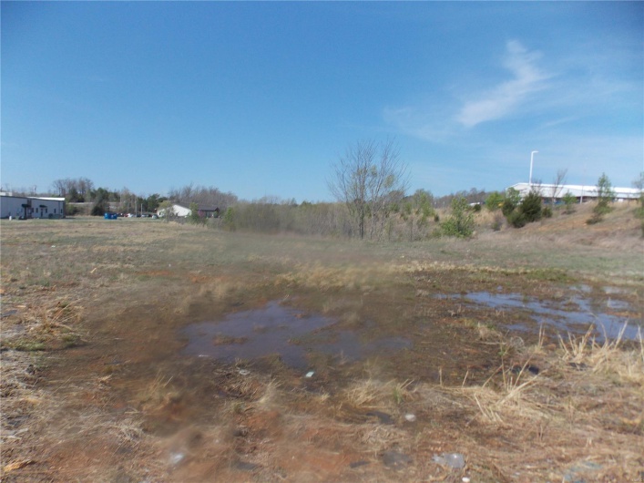 View of yard with a rural view