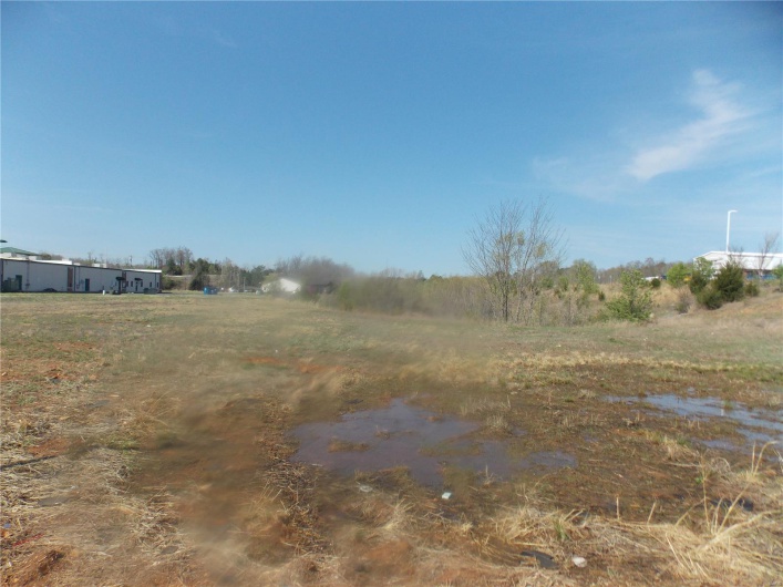 View of yard with a rural view