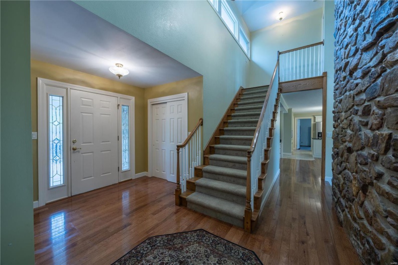 Foyer area with stairs to the private primary suite