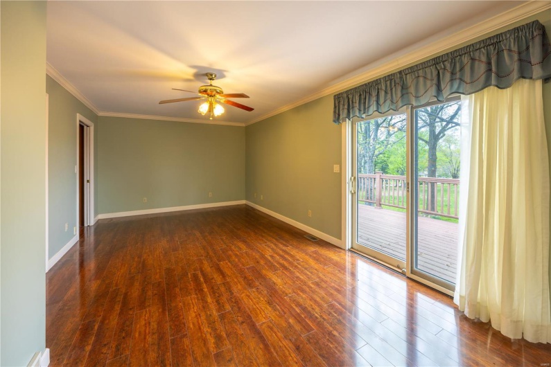 Primary bedroom opens to private balcony overlooking the back yard.