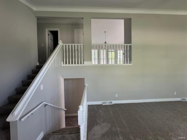 Staircase with baseboards, carpet flooring, and ornamental molding