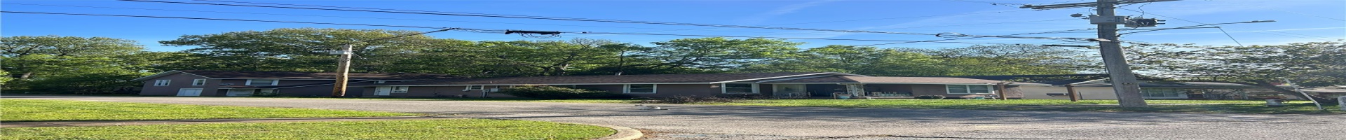 Residential For Sale View of front of home with a front yard, driveway, and covered porch