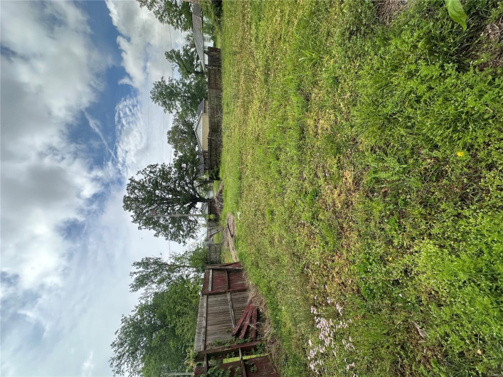 View of yard featuring fence