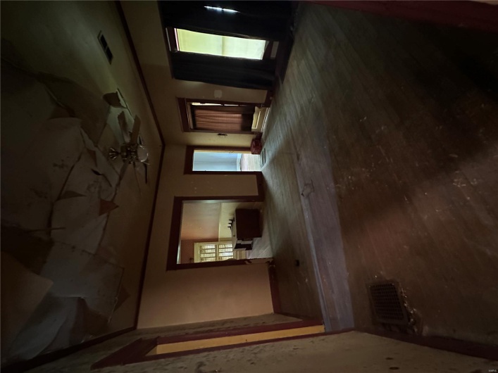 Unfurnished room with baseboards, visible vents, and a ceiling fan