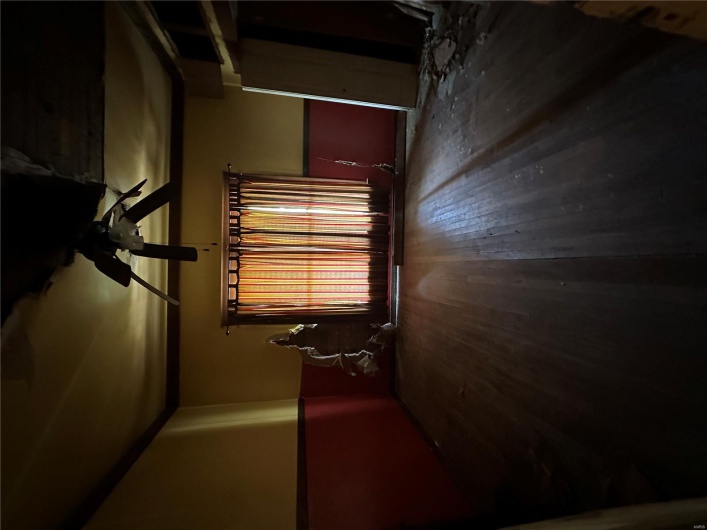 Spare room with hardwood / wood-style floors and a ceiling fan