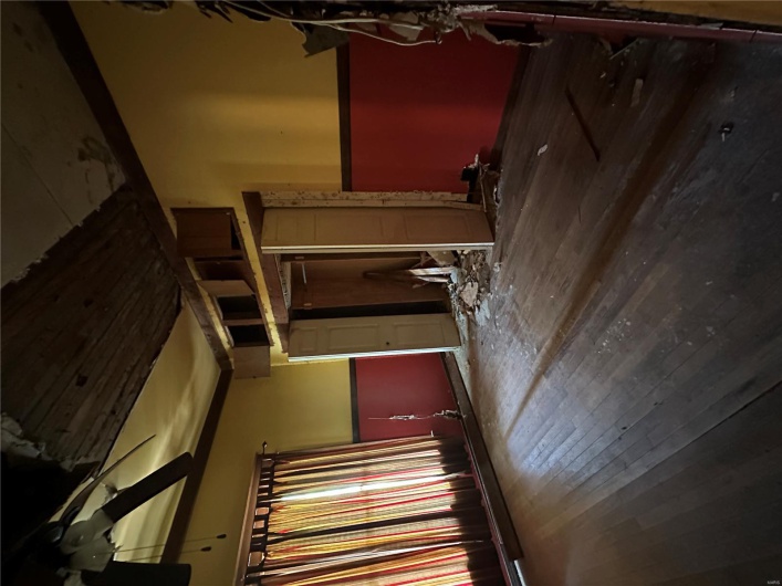 Spare room with wood-type flooring and ceiling fan