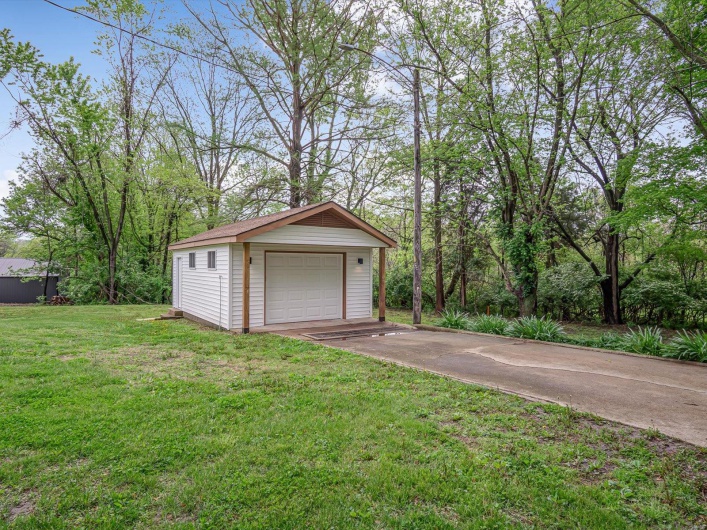 Detached garage with concrete driveway