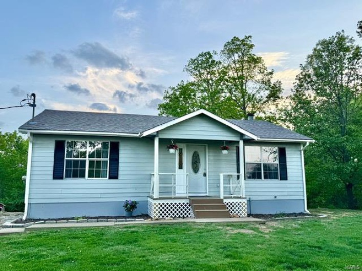 Home featuring a front yard