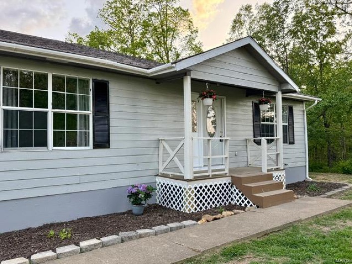 House featuring covered porch