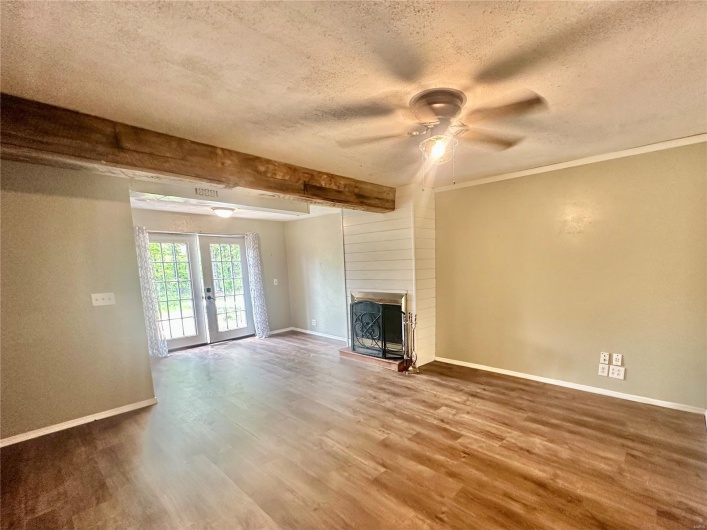 Family room with fireplace and french doors