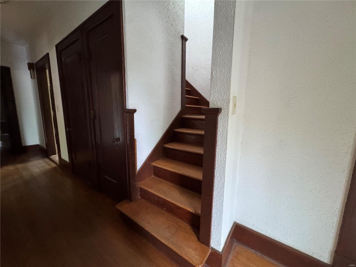 Stairway with wood finished floors
