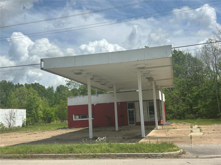 View of parking with a carport and driveway