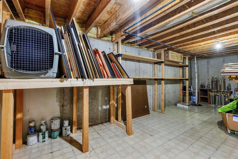 Unfinished basement with tile patterned floors