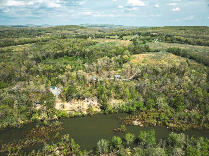 Birds eye view of property with a view of trees