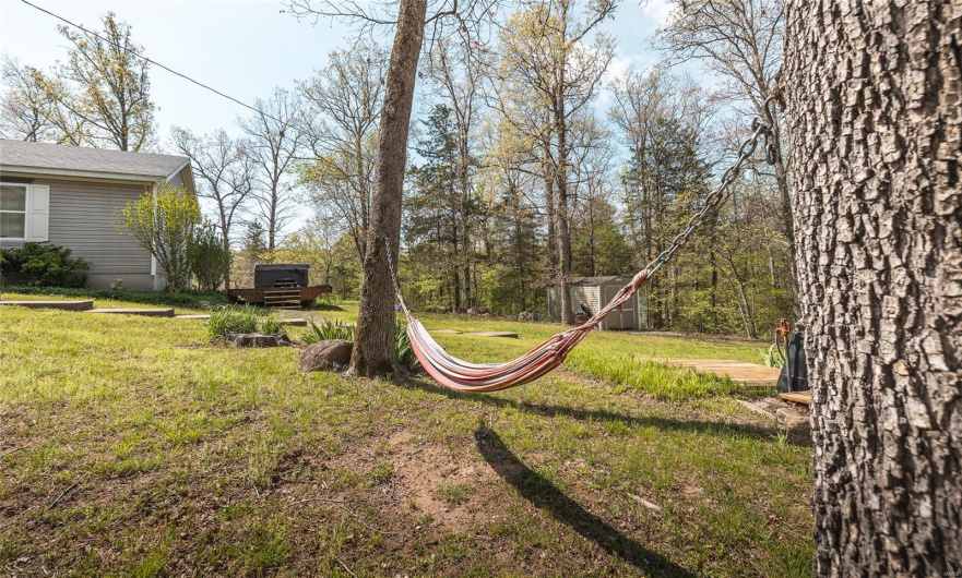 View of yard featuring an outdoor structure and a storage shed
