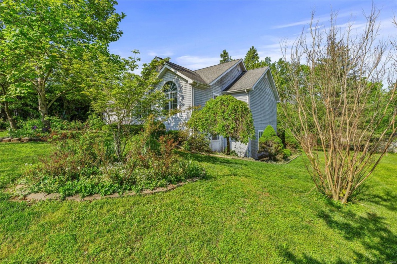 View of front of home featuring a lawn